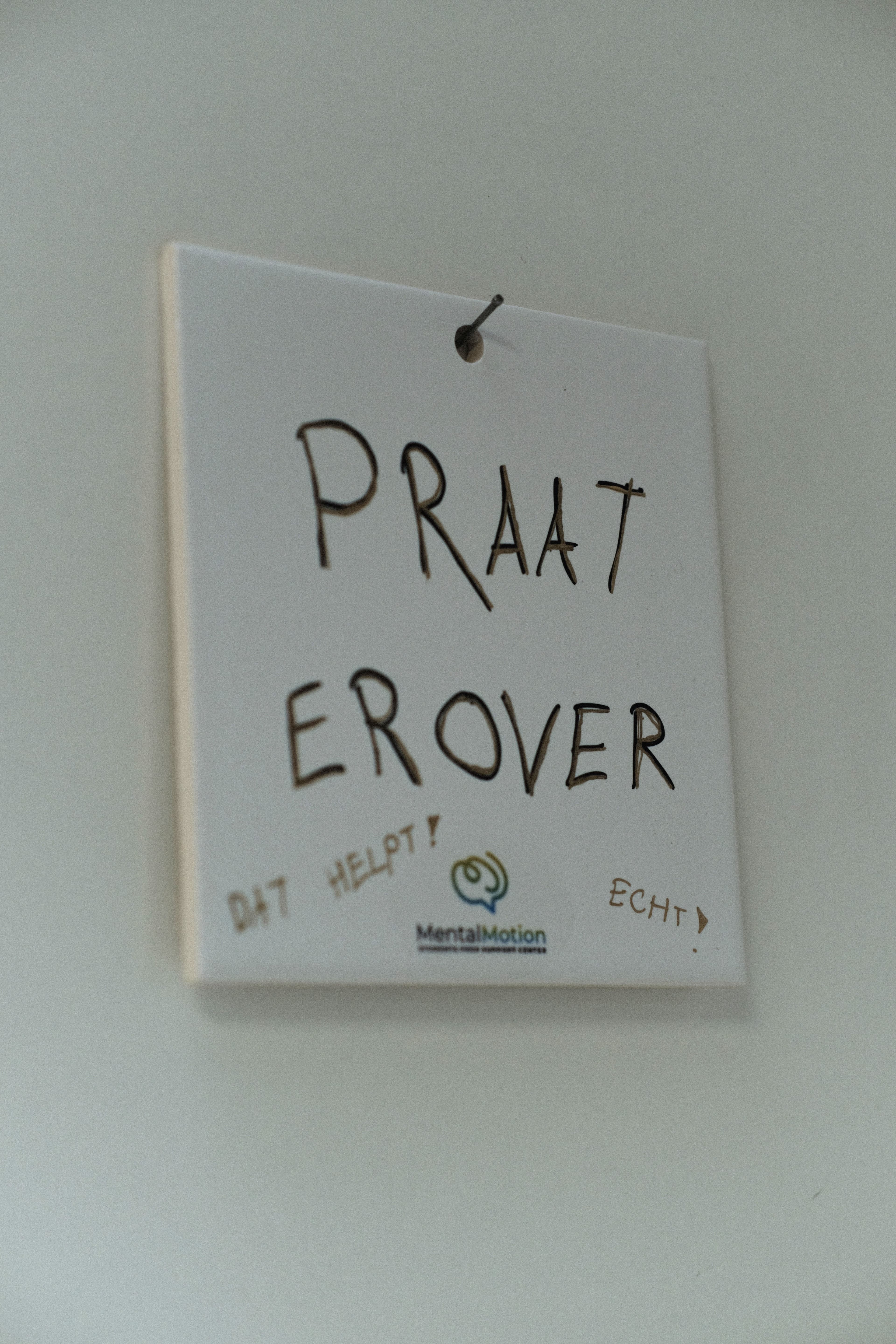 a group of people discussing a topic in a room